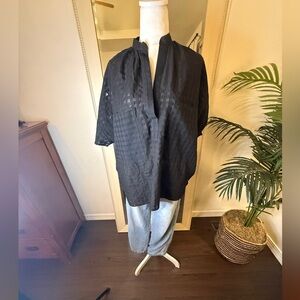 Two brand and made in the USA Women’s sheer black oversized short sleeve top.